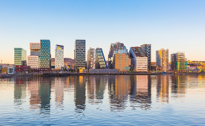 Modern buildings in Oslo with their reflection into the water